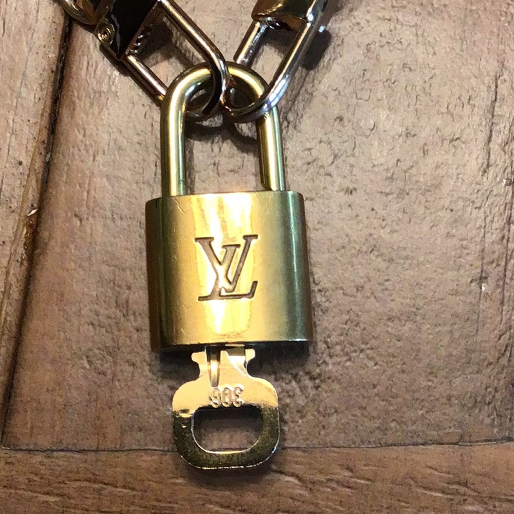 Authentic Louis Vuitton lock with chain necklace.